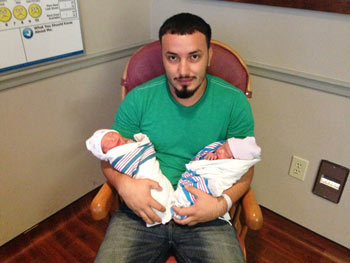 Cristian Zuniga pictured with son Cristian Jr. (left) and daughter April (right)